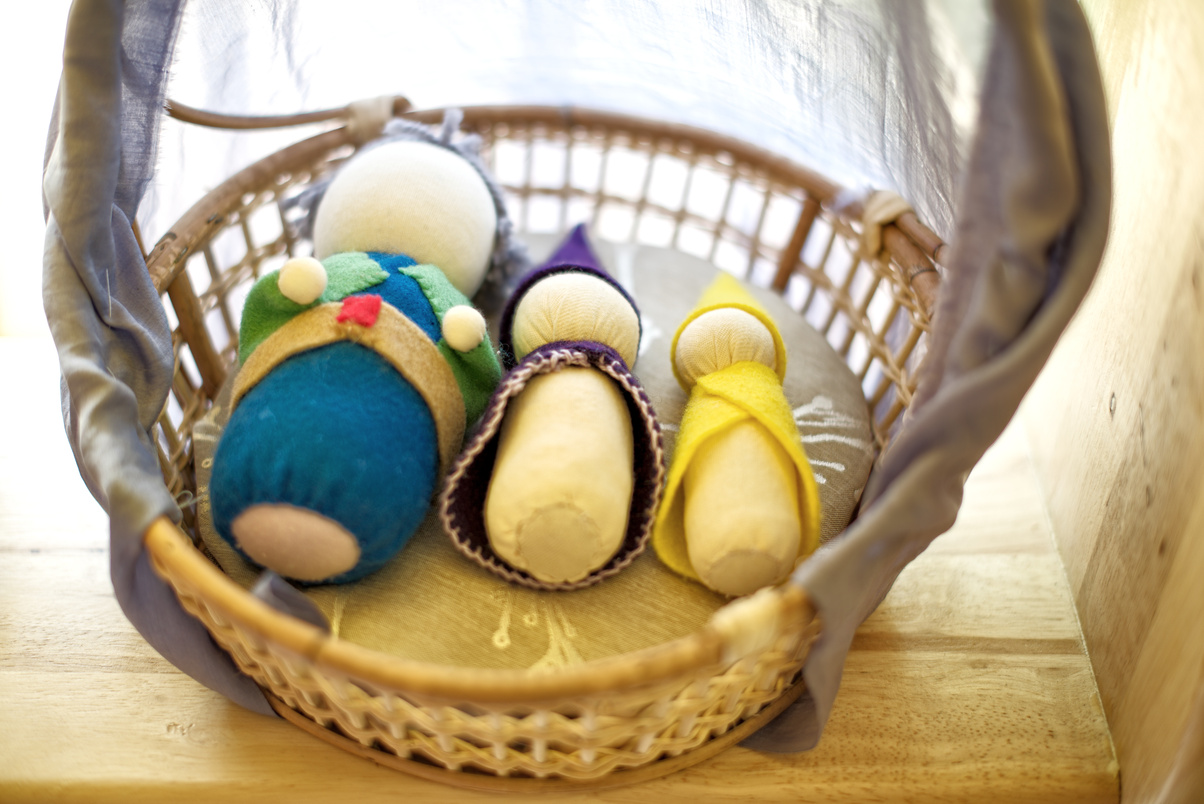 Handmade Waldorf soft toys on basket : closeup