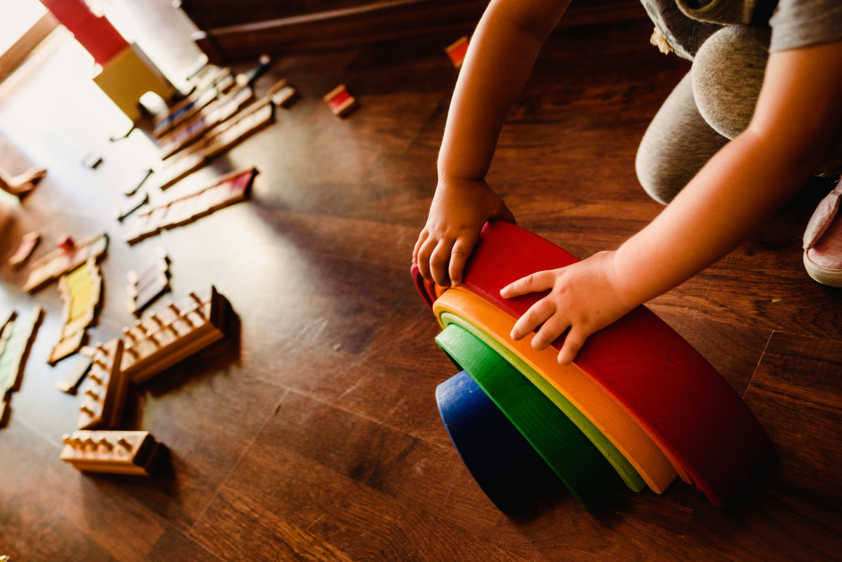 Children playing with wooden rainbow waldorf montessori